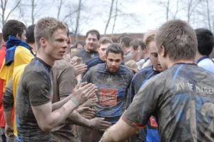 Olivier Vanlandeghem and team playing rugby