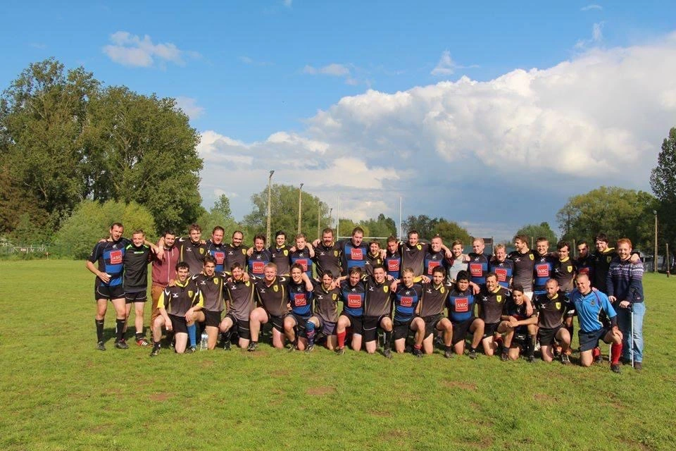 Olivier Vanlandeghem in group photo with his rugby team
